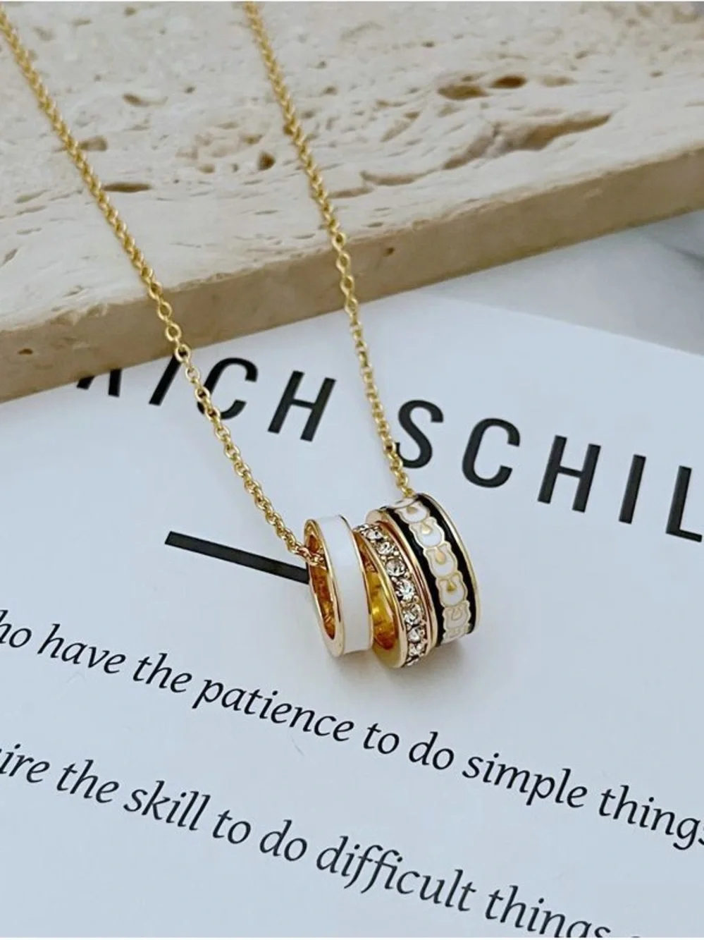 Coach Gold Necklace with White and Black Enamel Ring Pendants